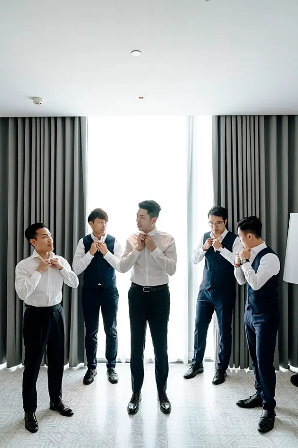 Epic groom getting ready shot with groomsmen - Madiow Photography