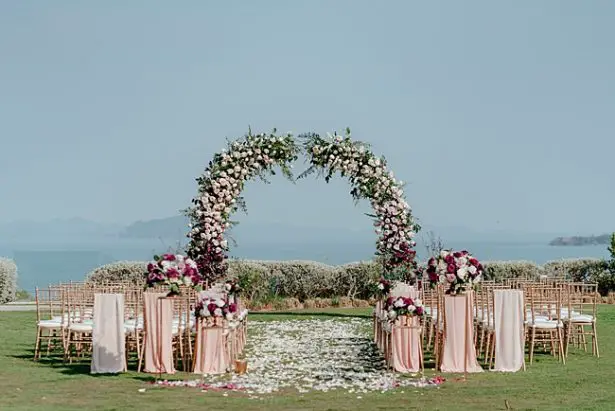 Romantic blush and burgundy wedding ceremony decor - Madiow Photography