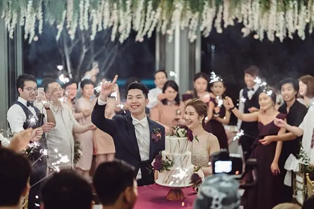 shot of bride and groom at reception with sparklers - Madiow Photography