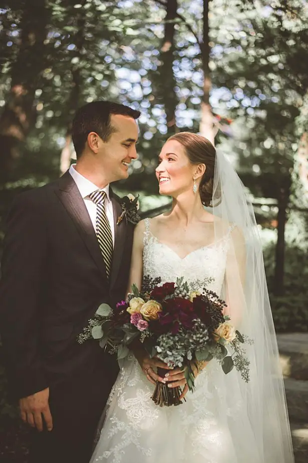 Elegant Fall Wedding photo of bride and groom with burgundy wedding flowers - Aileen Elizabeth Photography