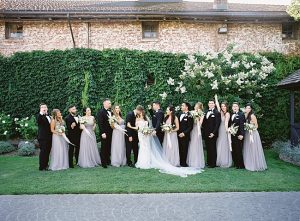Fun photo of bridal party celebrating the bride and groom- O’Malley Photography