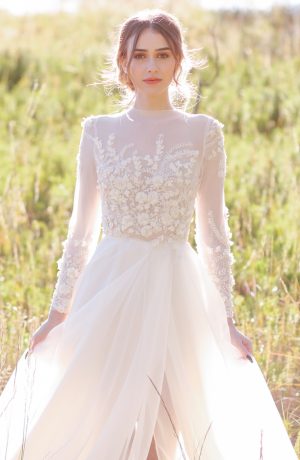 Modest A-line wedding dress with long sleeves - Photo: Tiffany Hudson Films