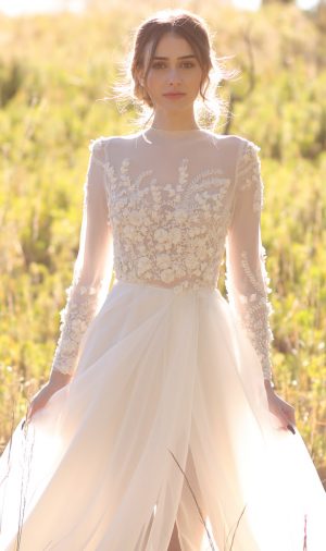 Modest A-line wedding dress with long sleeves - Photo: Tiffany Hudson Films