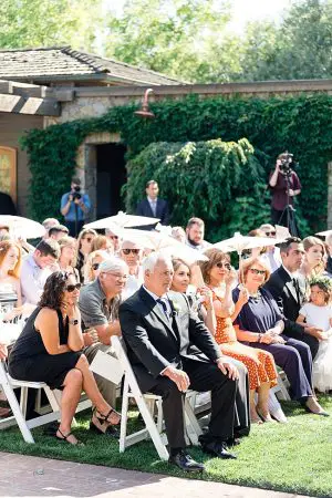 Napa Wedding outdoor wedding ceremony guests with umbrellas- O’Malley Photography