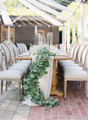 Napa Wedding reception table decor with overflowing greenery- O’Malley Photography