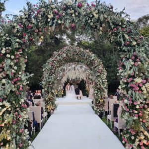 Opulent Luxury Wedding Ceremony with floral arches - Photography: Vincent Zasil