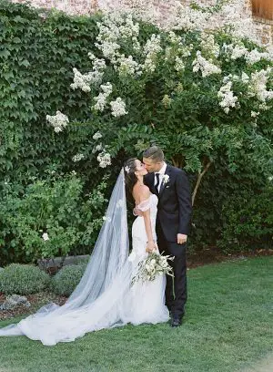 Romantic shot of bride and groom kissing on their Napa wedding day- O’Malley Photography