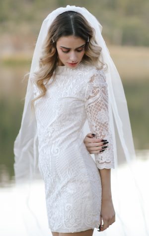 Short wedding dress with long sleeves - Photo: Tiffany Hudson Films