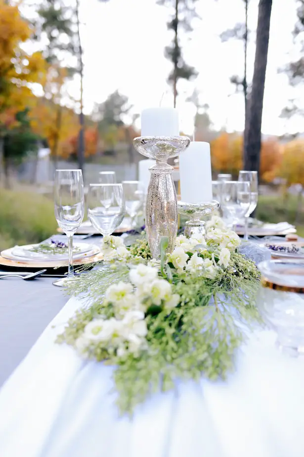 Silver and gold reception decor with greenery and white flowersRomantic waterside reception at the House of Maganda - Photo: Tiffany Hudson Films