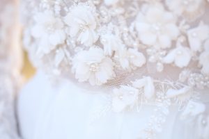 Unique wedding dress with delicate florals and beading - Photo: Tiffany Hudson Films