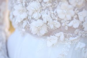 Unique wedding dress with delicate florals and beading - Photo: Tiffany Hudson Films