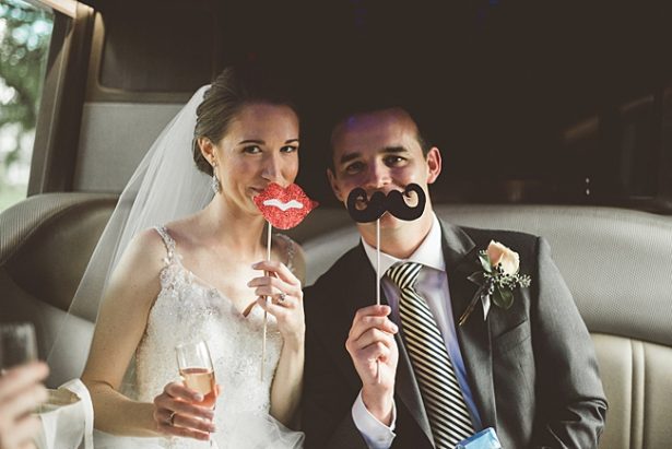 bride and groom fun photo in photobooth with props - Aileen Elizabeth Photography