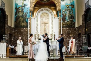 Cathedral wedding photo of bride and groom first kiss - Photography: NST Pictures