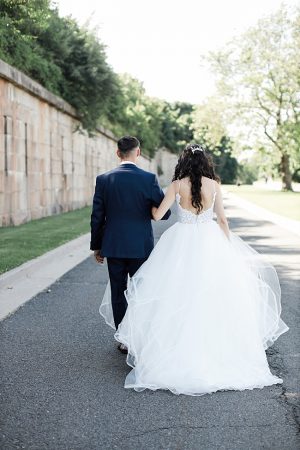 Country Club Wedding photo of bride and groom walking with bride in a ball gown - Photography: NST Pictures