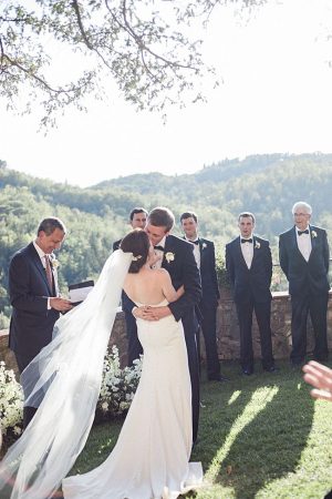 First kiss as husband and wife during wedding ceremony - Purewhite Photography