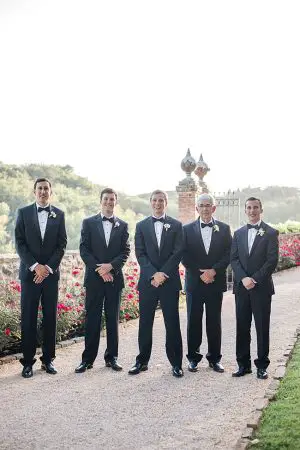 Groom and groomsmen in black tuxes and bowties - Purewhite Photography
