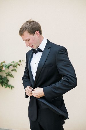 Groom getting ready in black tux with bowtie - Purewhite Photography