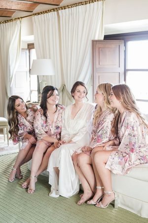 Photo of bride with bridesmaids in matching robes - Purewhite Photography