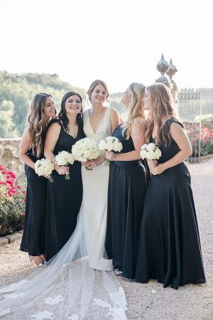 Photo of bride and bridesmaids with black bridesmaids dresses- Purewhite Photography