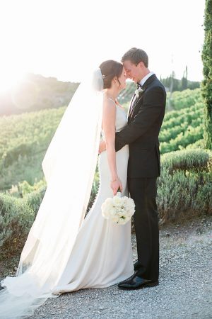 Sunset wedding photo of bride and groom in Tuscany vineyard- Purewhite Photography