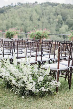 Tuscany Wedding ceremony decor with white flowers down the aisle - Purewhite Photography