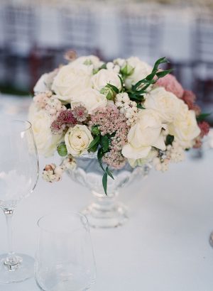 Tuscany Wedding reception centerpiece with white and mauve flowers - Purewhite Photography
