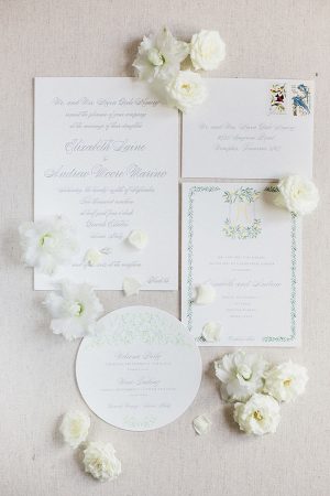 White wedding inviation suite with custom crest and flowers- Purewhite Photography
