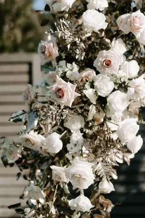 Unique wedding ceremony arbor with white and blush flowers- Foolishly Rushing In Photography