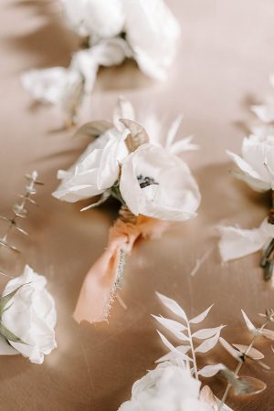 White and rose gold wedding boutonnière- Foolishly Rushing In Photography