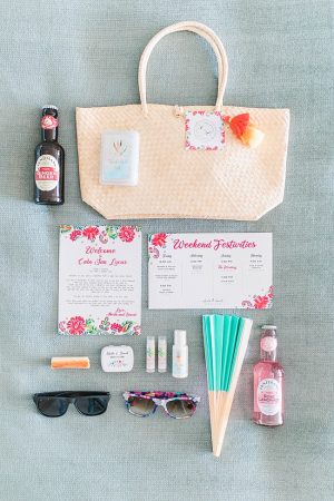 Cabo Destination Wedding welcome bag with fan sunglasses and drinks - Photography: JBJ Pictures