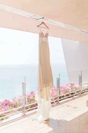 Hanging wedding dress near the water for Cabo Destination Wedding - Photography: JBJ Pictures