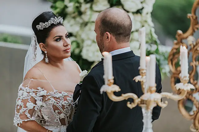 Sweet photo of bride and groom during ceremony - Photo: Dmitry Shumanev Production