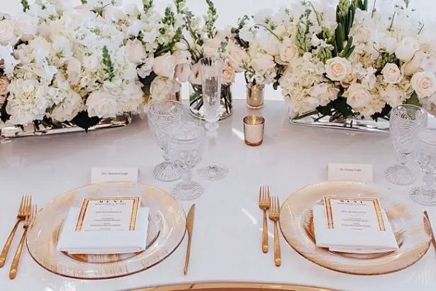 White and Gold Wedding reception table setup with custom menu - Photo: Dmitry Shumanev Production