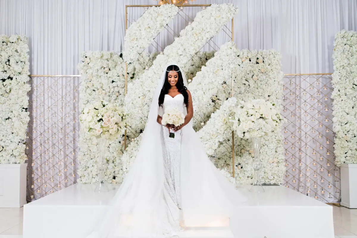 African American bride at her Luxury white floral wedding ceremony decor - Photography: Pharris Photos