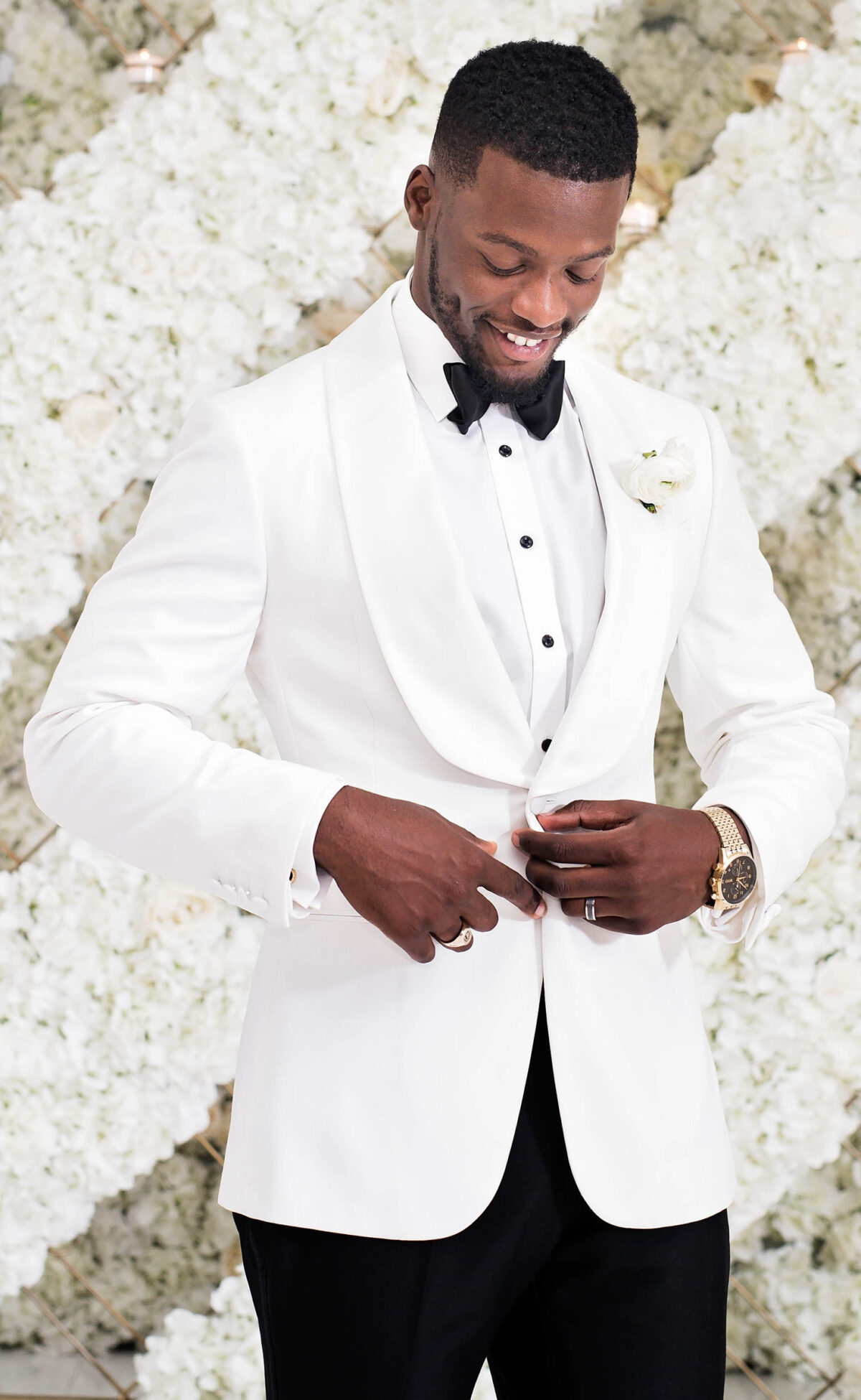 African American groom wearing a white tuxedo - Photography: Pharris Photos