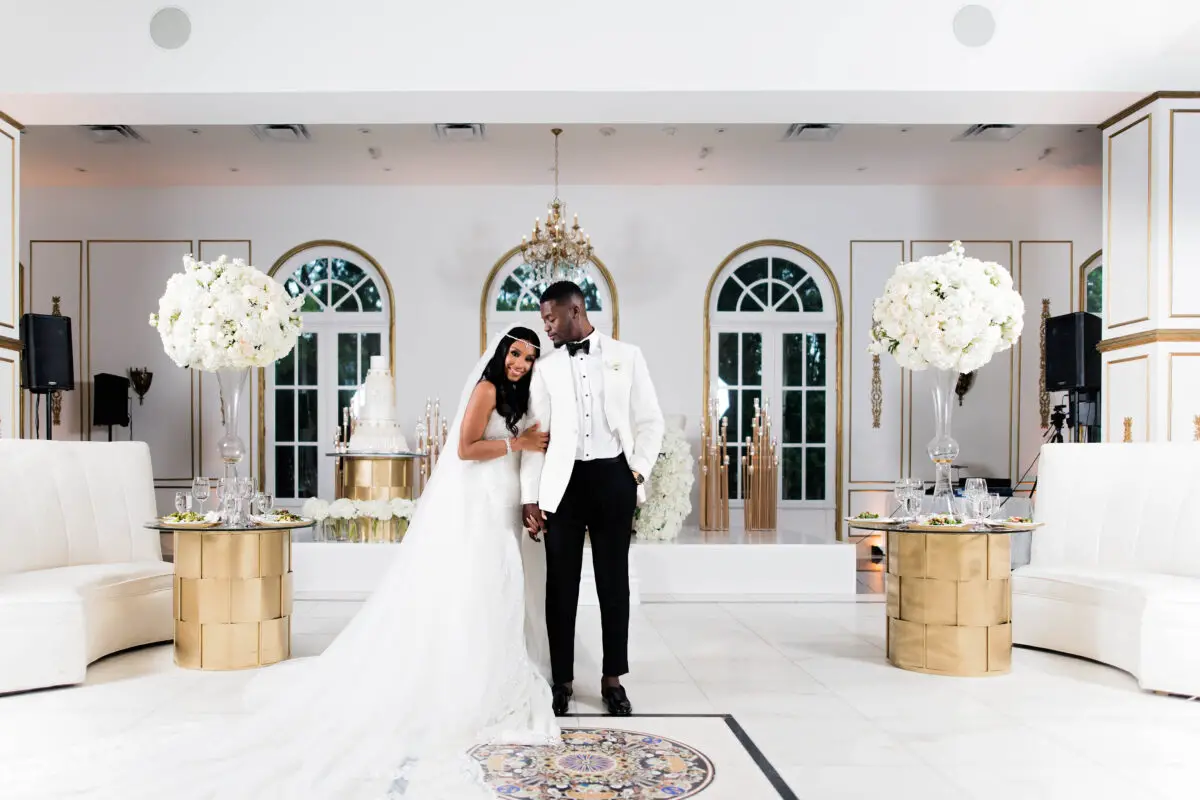 Luxury bride and groom photo at their white and gold wedding reception - Photography: Pharris Photos
