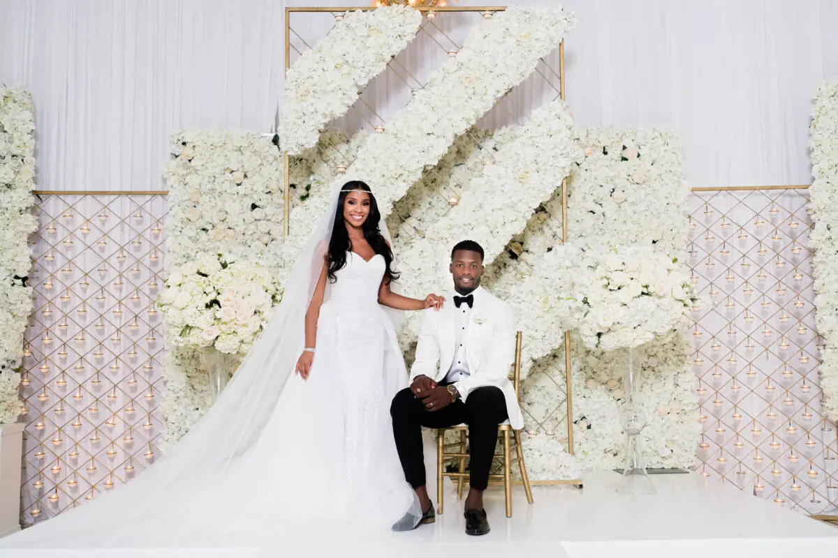 Luxury wedding with floral background and an African American couple - Photography: Pharris Photos
