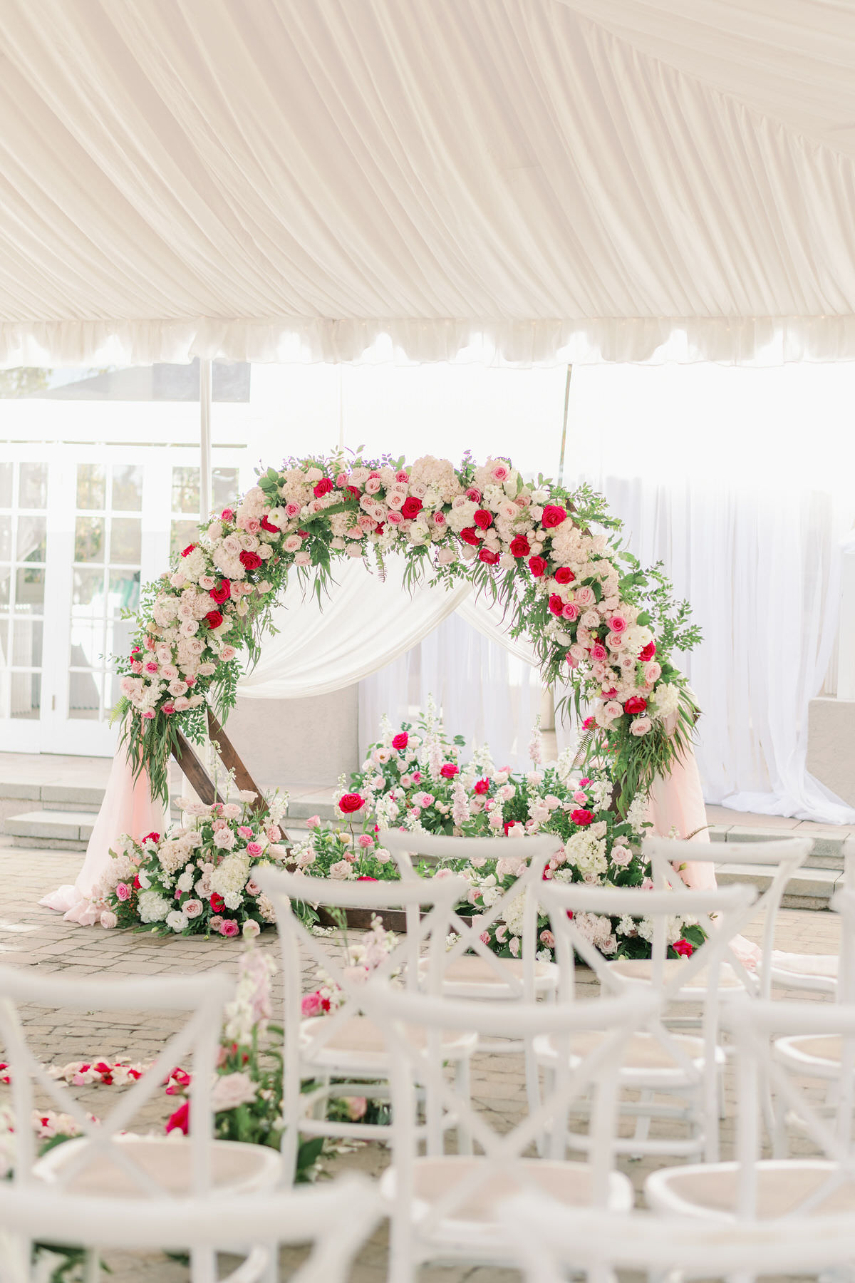Circular wedding ceremony arch with flowers - Peony Park Photography