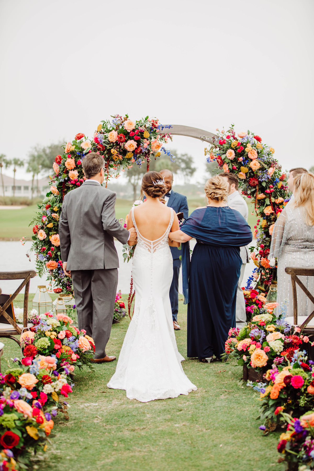 Outdoor wedding ceremony decor with colorful flowers - Bohemian Road Photography