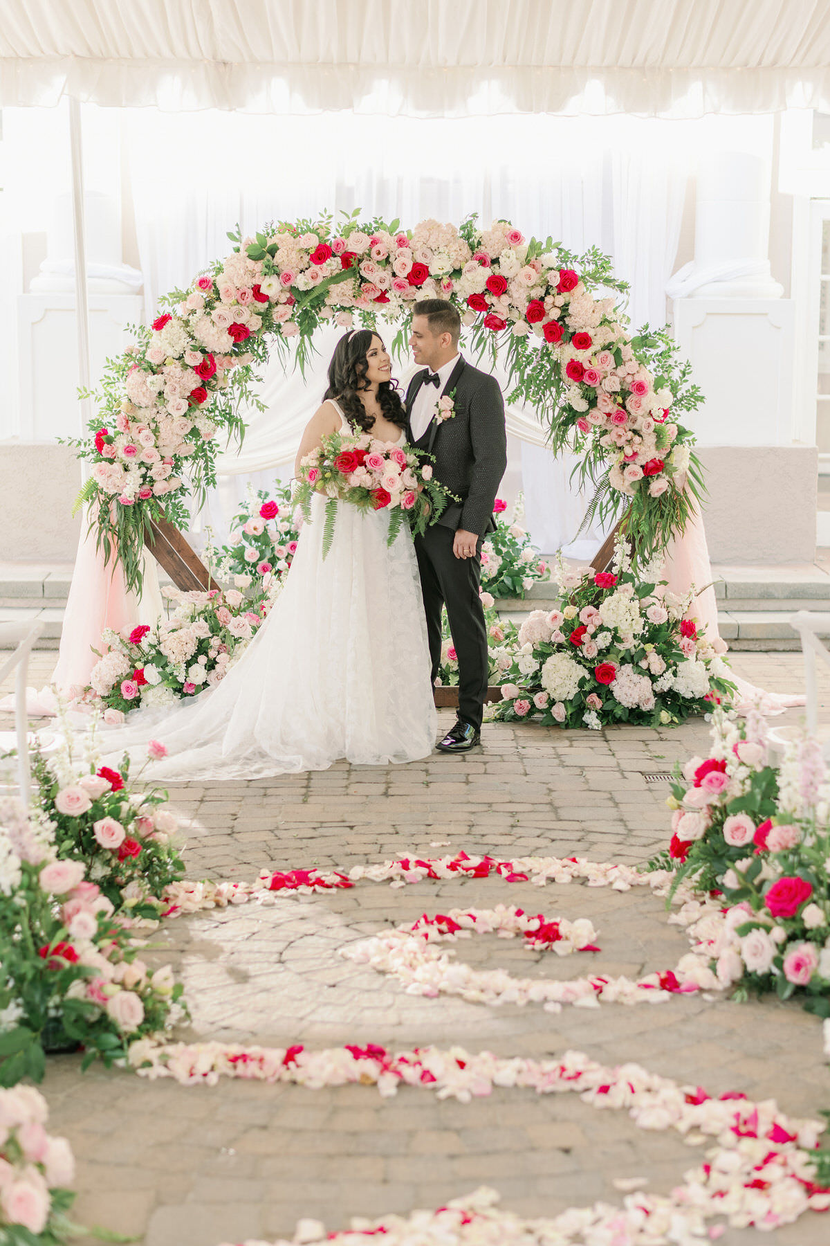 Pink wedding ceremony arch decorations - Peony Park Photography