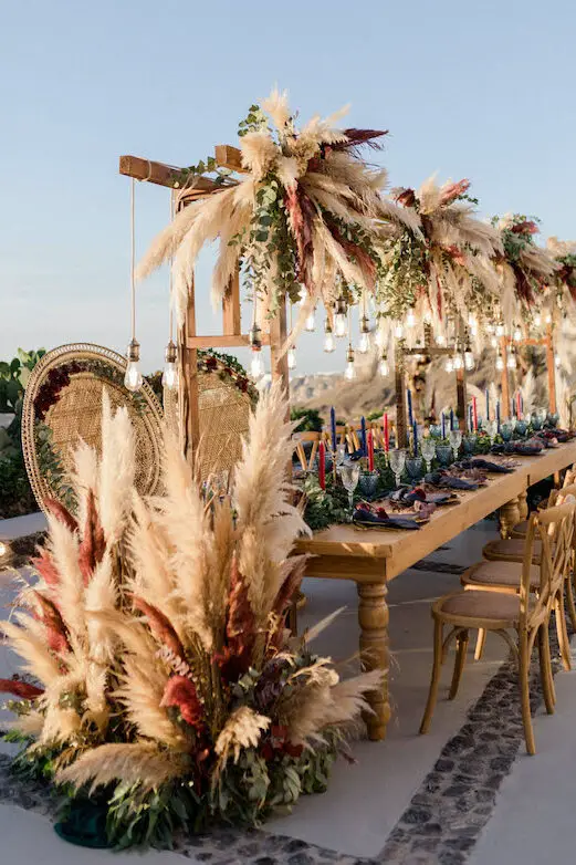 Pampas grass wedding reception decor - Photography: Anna Roussos
