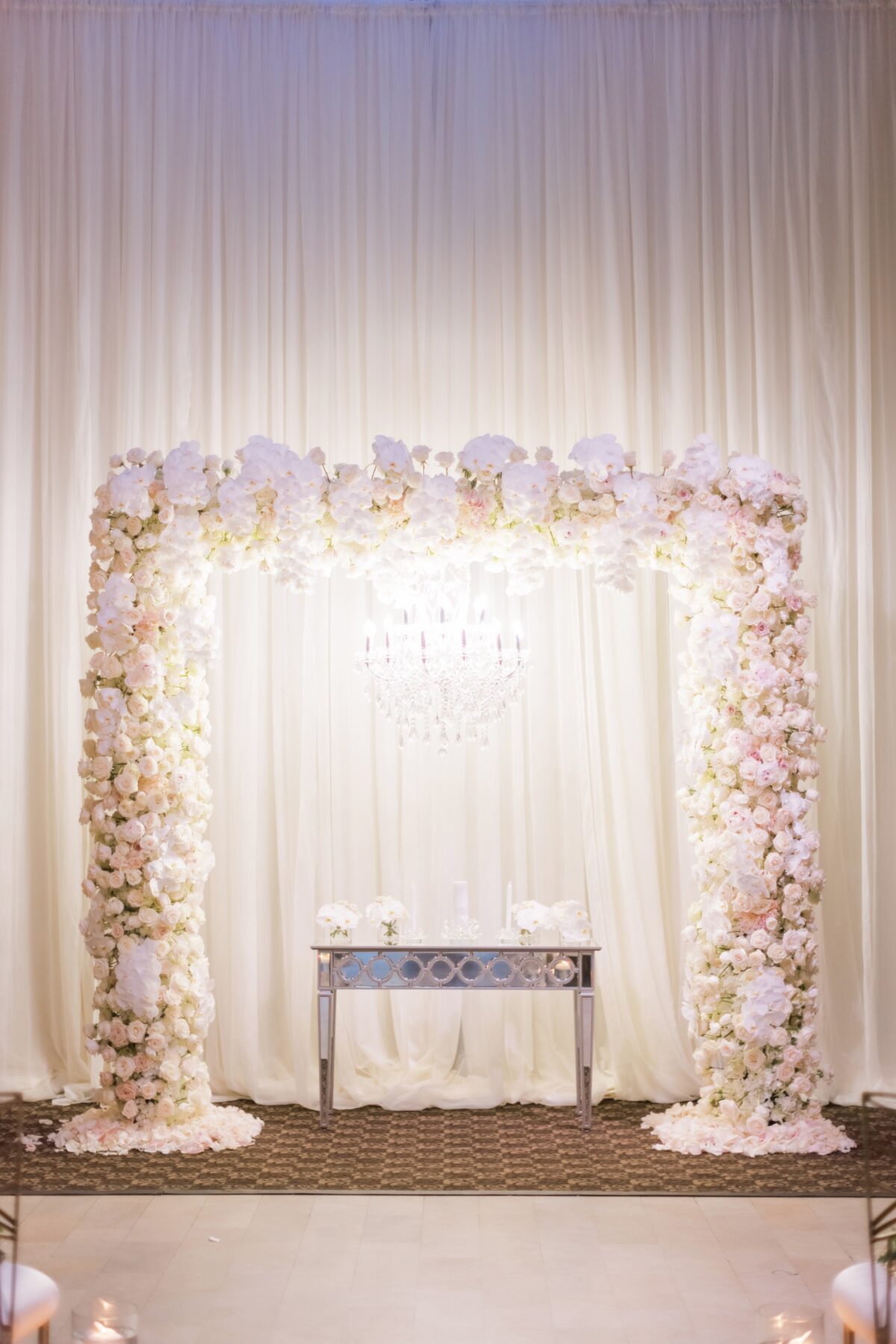 Blush wedding ceremony altar with floral arch - Photography: Brooke Images