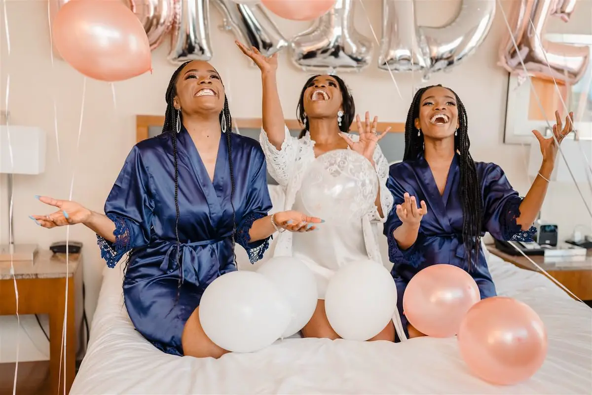 Bride and bridesmaids getting ready suite balloons - Tunji Studio Photography