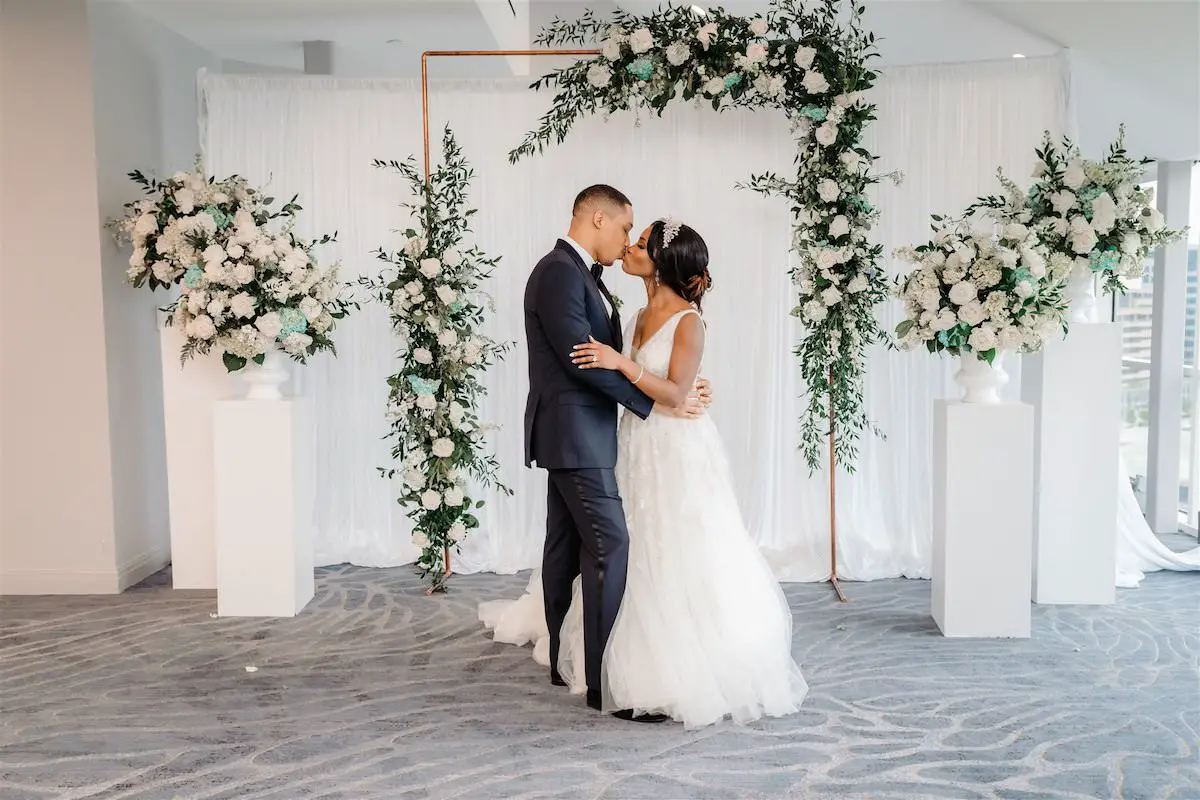 Luxury bride and groom portrait with floral arch - Tunji Studio Photography