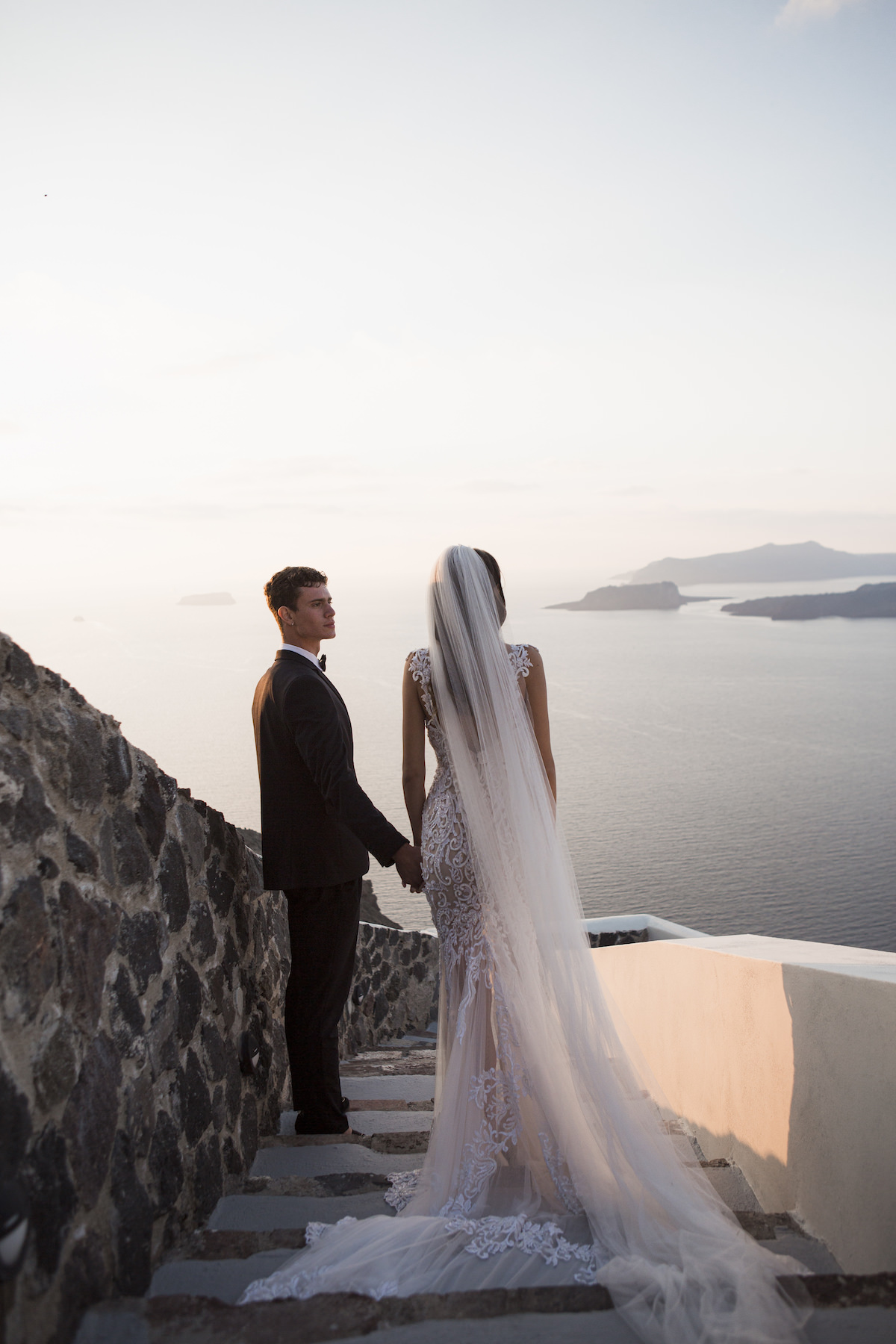 Romantic Santorini wedding photo with wedding veil- Eva Rendl Photography